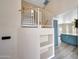 Foyer showing the staircase and a view of the kitchen with stainless steel appliances at 13676 N 73Rd Dr, Peoria, AZ 85381