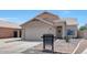 Charming beige two-story home with a tile roof, desert landscaping, and a two-car garage at 13676 N 73Rd Dr, Peoria, AZ 85381