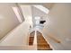 Staircase with wooden steps and white railings leads to the upper level, enhancing the home's flow at 13676 N 73Rd Dr, Peoria, AZ 85381