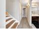 Hallway featuring stairs leading to a bathroom, enhancing flow and access within the home at 13676 N 73Rd Dr, Peoria, AZ 85381