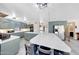 Spacious kitchen featuring a large island with chairs, stainless steel appliances, and an open floorplan at 13676 N 73Rd Dr, Peoria, AZ 85381