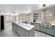 Spacious kitchen with a large center island, updated appliances, and modern finishes at 13676 N 73Rd Dr, Peoria, AZ 85381