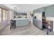 Bright kitchen featuring stainless steel appliances, a large island with seating, and ample natural light at 13676 N 73Rd Dr, Peoria, AZ 85381