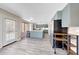 Bright open-concept living area features modern flooring and ample natural light and access to the kitchen at 13676 N 73Rd Dr, Peoria, AZ 85381