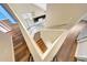 A staircase with wood treads and white risers, leading to an open living space at 13676 N 73Rd Dr, Peoria, AZ 85381