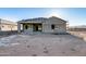 Backyard of new house, featuring covered patio and blank canvas ready for landscaping at 14723 N 73Rd Dr, Peoria, AZ 85381
