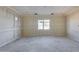 A new bedroom with decorative wall moldings and a large window offering natural light at 14723 N 73Rd Dr, Peoria, AZ 85381