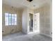 Bedroom with walk-in closet and ensuite bathroom in new home construction at 14723 N 73Rd Dr, Peoria, AZ 85381