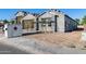 The exterior of a new construction home with scaffolding and building materials at 14723 N 73Rd Dr, Peoria, AZ 85381