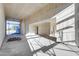 Spacious living area showcases natural light in unfinished new construction at 14723 N 73Rd Dr, Peoria, AZ 85381