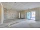 Spacious living room featuring decorative wall moldings and a sliding glass door for easy outdoor access at 14723 N 73Rd Dr, Peoria, AZ 85381