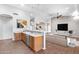 Bright, open-concept living room and kitchen with wood floors, modern furniture and decor at 22616 S 194Th St, Queen Creek, AZ 85142