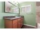Bathroom vanity with granite countertop and a large mirror at 2938 N 18Th Ave, Phoenix, AZ 85015