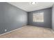 Relaxing bedroom offers comfortable carpet flooring and a bright window at 2938 N 18Th Ave, Phoenix, AZ 85015