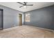 Comfortable bedroom with ceiling fan, closet, and neutral carpeting at 2938 N 18Th Ave, Phoenix, AZ 85015