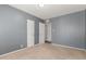 Neutral bedroom with carpeted flooring, modern doors, and fresh paint at 2938 N 18Th Ave, Phoenix, AZ 85015