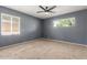 Spacious carpeted bedroom featuring natural light and modern ceiling fan at 2938 N 18Th Ave, Phoenix, AZ 85015