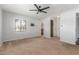 A bright bedroom features a ceiling fan, a window, and a closet space at 2938 N 18Th Ave, Phoenix, AZ 85015