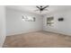 A bright bedroom is complete with two windows and a ceiling fan at 2938 N 18Th Ave, Phoenix, AZ 85015