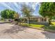 Classic ranch-style home with mature trees and meticulously landscaped front yard on a sunny day at 2938 N 18Th Ave, Phoenix, AZ 85015