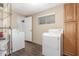 Bright laundry room with storage cabinets and modern machines at 2938 N 18Th Ave, Phoenix, AZ 85015