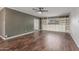 Spacious living area with built-in cabinets and shelving, plus dark wood-look flooring at 2938 N 18Th Ave, Phoenix, AZ 85015