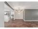 Stylish open-concept living area with modern lighting fixture and bar access at 2938 N 18Th Ave, Phoenix, AZ 85015