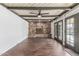 Inviting living room boasts a stone fireplace, ceiling fan, and outdoor access at 2938 N 18Th Ave, Phoenix, AZ 85015