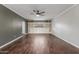 Open living space with dark wood-look floors and custom built-in cabinets and shelves at 2938 N 18Th Ave, Phoenix, AZ 85015