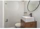 This powder room has modern fixtures, a stylish sink, and a new toilet at 2938 N 18Th Ave, Phoenix, AZ 85015