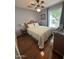 Comfortable bedroom with hardwood floors, ceiling fan, and plenty of natural light at 955 W Obispo Ave, Mesa, AZ 85210