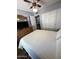 Bedroom with large closets, ceiling fan, and hardwood floors at 955 W Obispo Ave, Mesa, AZ 85210