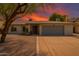 Charming single-story home with well-maintained landscape, inviting entrance, and a large two car garage at 955 W Obispo Ave, Mesa, AZ 85210
