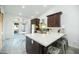 Contemporary kitchen with quartz countertops, stainless steel appliances, island seating and backyard access through French doors at 1321 E Brill St, Phoenix, AZ 85006