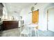 Bright kitchen boasts a dining area, wood-look tile floors, and a striking wood barn door at 1321 E Brill St, Phoenix, AZ 85006