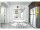 Bright breakfast nook with stainless steel appliances and easy access to the backyard through stylish French doors at 1321 E Brill St, Phoenix, AZ 85006