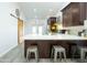 Modern kitchen with quartz countertops, stainless steel appliances, island seating, and access to a private patio at 1321 E Brill St, Phoenix, AZ 85006