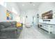 Inviting living room features tile floors, neutral decor and seamlessly connects living spaces for comfortable everyday living at 1321 E Brill St, Phoenix, AZ 85006