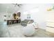 Bright and airy living room with vaulted ceilings, modern decor, tile floors and open to the kitchen for seamless entertaining at 1321 E Brill St, Phoenix, AZ 85006