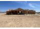 Exterior view of a home under construction, highlighting the structure and framing work at 1664 N 431St Ave, Tonopah, AZ 85354