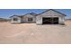 New construction shows exterior with unfinished siding and visible framing, set against a desert landscape at 1664 N 431St Ave, Tonopah, AZ 85354