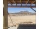 Framed view of a desert landscape with mountain, showing the natural beauty visible from the property at 1664 N 431St Ave, Tonopah, AZ 85354