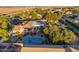 Aerial view of a luxurious home featuring a pool, patio, and lush landscaping at 21315 E Marsh Rd, Queen Creek, AZ 85142