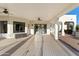 Large covered back patio with ceiling fans, offering shade and style, perfect for outdoor living at 21315 E Marsh Rd, Queen Creek, AZ 85142