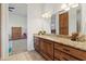 Bathroom with a large granite vanity with lots of storage, plus access to the bedroom at 21315 E Marsh Rd, Queen Creek, AZ 85142