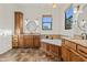Elegant bathroom with a soaking tub, granite countertops and dual sinks at 21315 E Marsh Rd, Queen Creek, AZ 85142