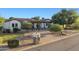 Charming single story home with a desert landscape, paver driveway, and manicured curb appeal at 21315 E Marsh Rd, Queen Creek, AZ 85142