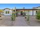 Beautiful single-story home with desert landscaping and a brick walkway leading to the front door at 21315 E Marsh Rd, Queen Creek, AZ 85142