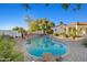 Backyard pool surrounded by desert landscaping and lush greenery, creating a private oasis at 21315 E Marsh Rd, Queen Creek, AZ 85142