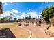 Spacious backyard featuring a brick patio and three fire pits for outdoor enjoyment and gatherings at 3008 W Michigan Ave, Phoenix, AZ 85053